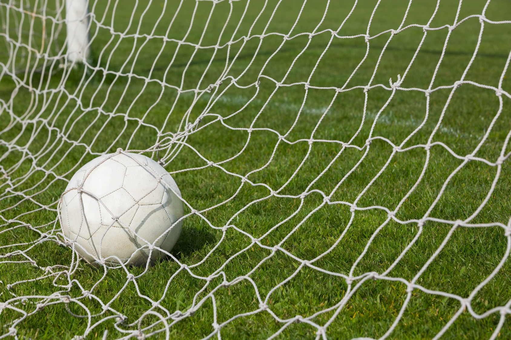 Football at the back of the net